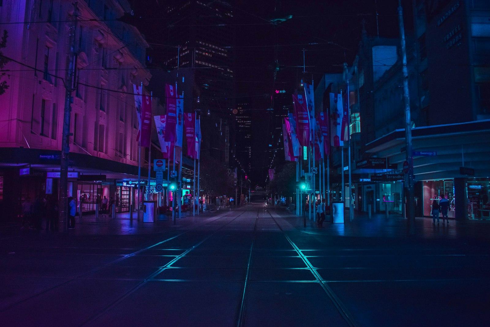 Urban street at night in a blue glow