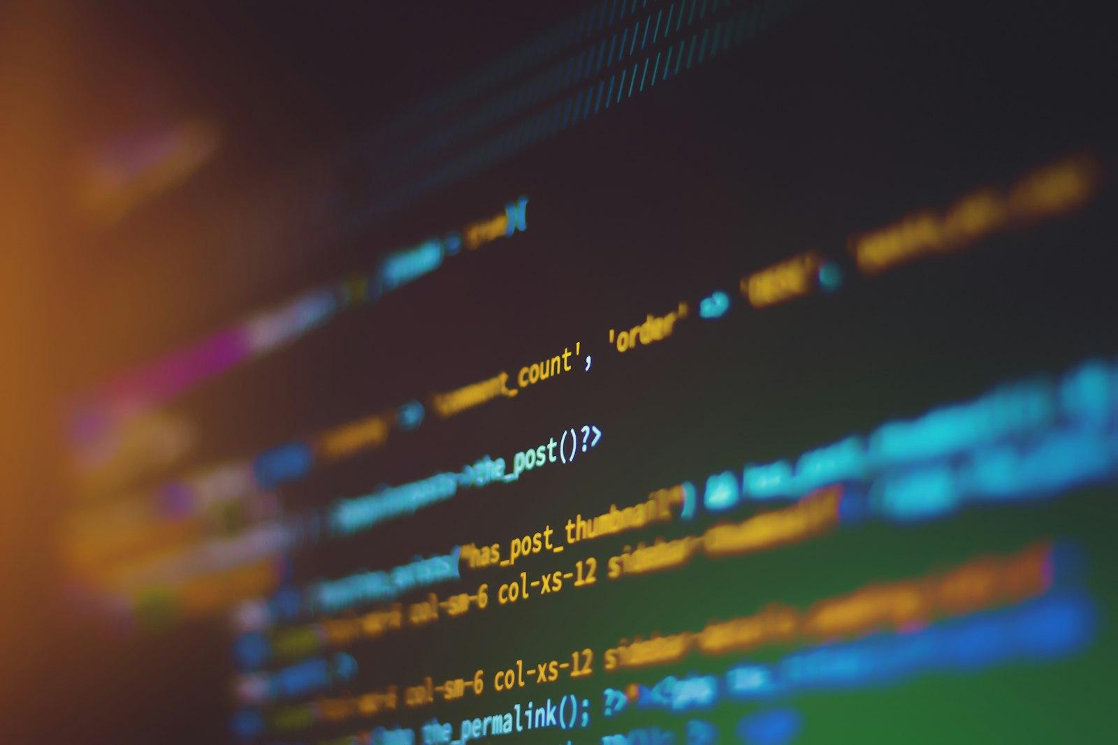 Multicolored programming code on a dark background